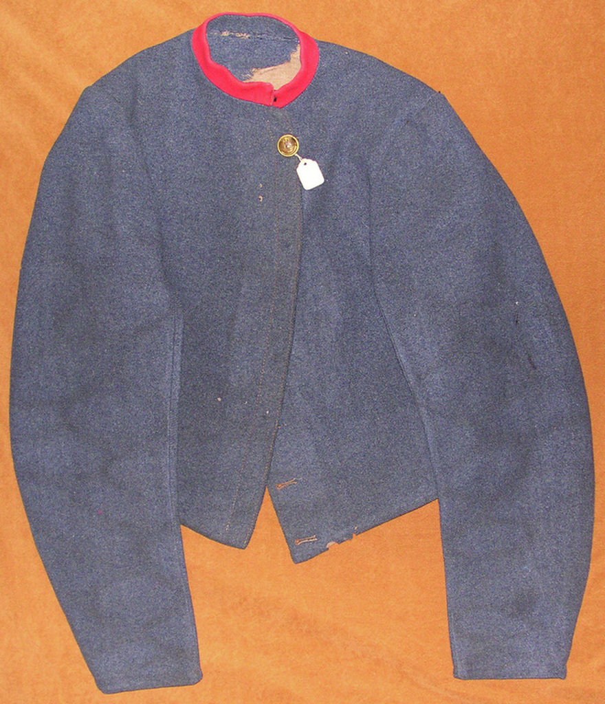 FIG 5: Another front view depicts the machine stitching along the button lapel.  The scarlet collar facing has been added to what a plain variant Tait jacket.  The Virginia button may indicate that a Virginia soldier originally wore the jacket.  Images courtesy of History Colorado, Francis Marion Durham Collection, Photo. #2005.52.3.v2.